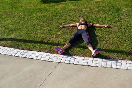 Tired Runner Laying on Grass