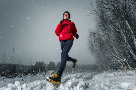 Woman running in the snow