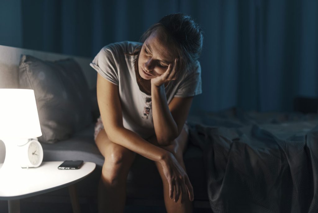 woman awake suffering from insomnia