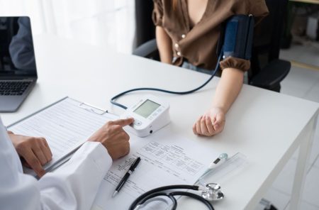 woman doing a health check in at the doctor's office